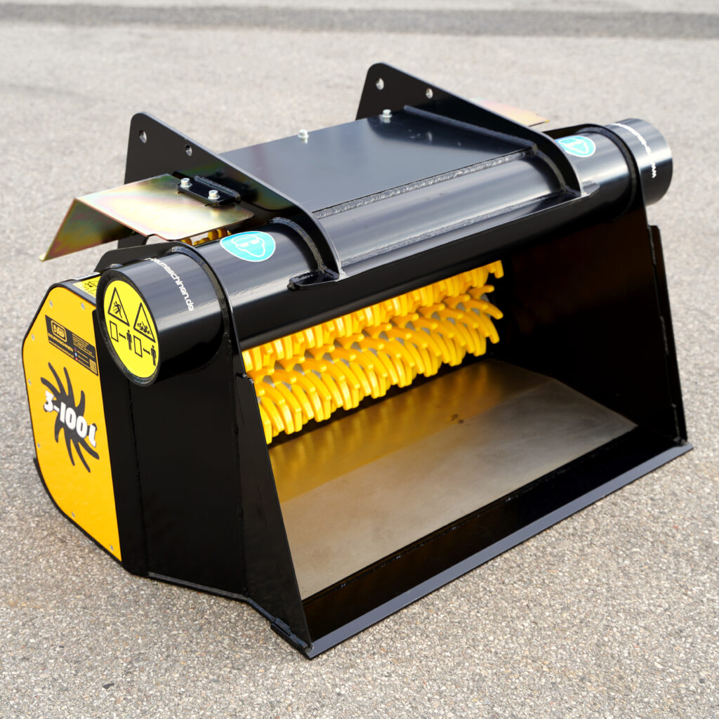 Das schwarze GYRUstar-Gerät mit gelben Walzen und Warnsymbolen steht auf Asphalt, mit massiven Stahlplatten und einem kompakten Gehäuse im Fokus.