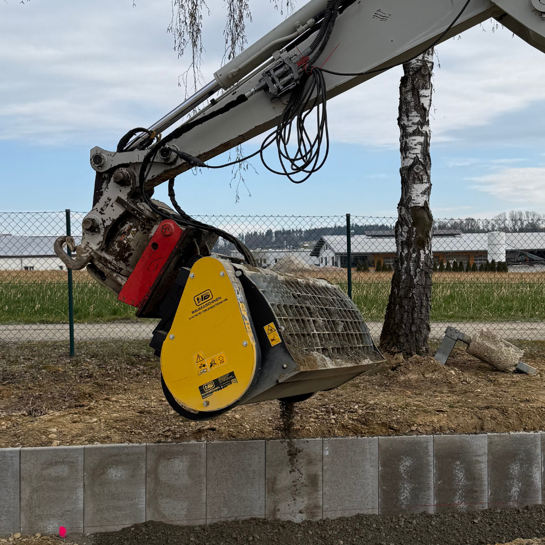 Concrete mixing bucket on an excavator